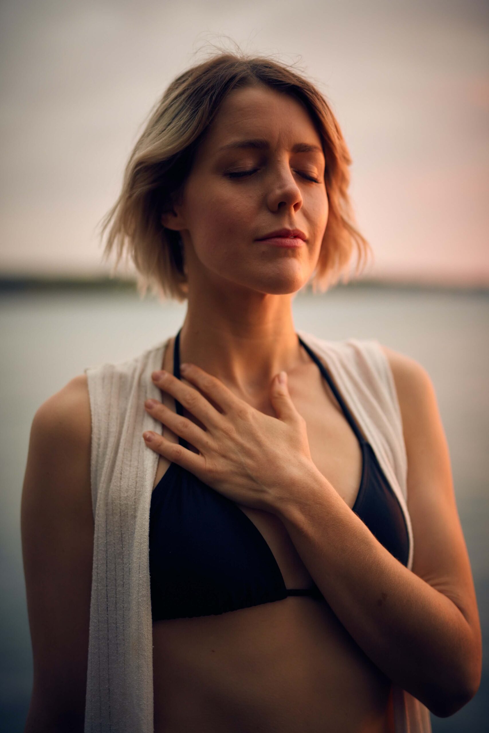 woman hand on chest feeling her emotions